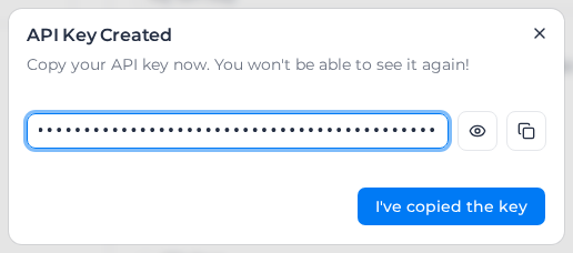 API Key Created dialog with the new key hidden, the show and copy buttons, and I've copied the key